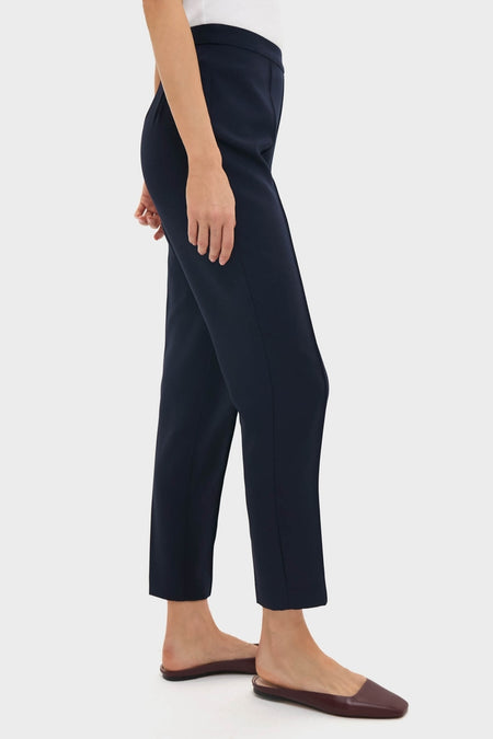 Classic Navy Audrey Pants offer an effortless, high-end look with a slimming fit and pinched seam, paired with backless slip-ons for a fun, versatile style.