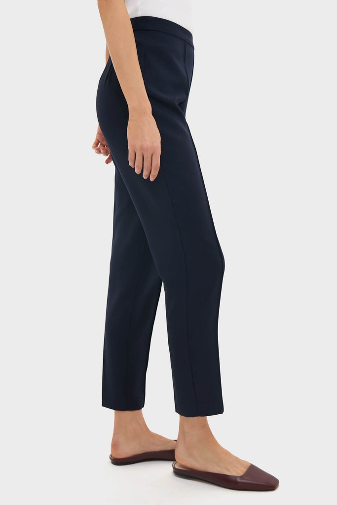 Classic Navy Audrey Pants offer an effortless, high-end look with a slimming fit and pinched seam, paired with backless slip-ons for a fun, versatile style.