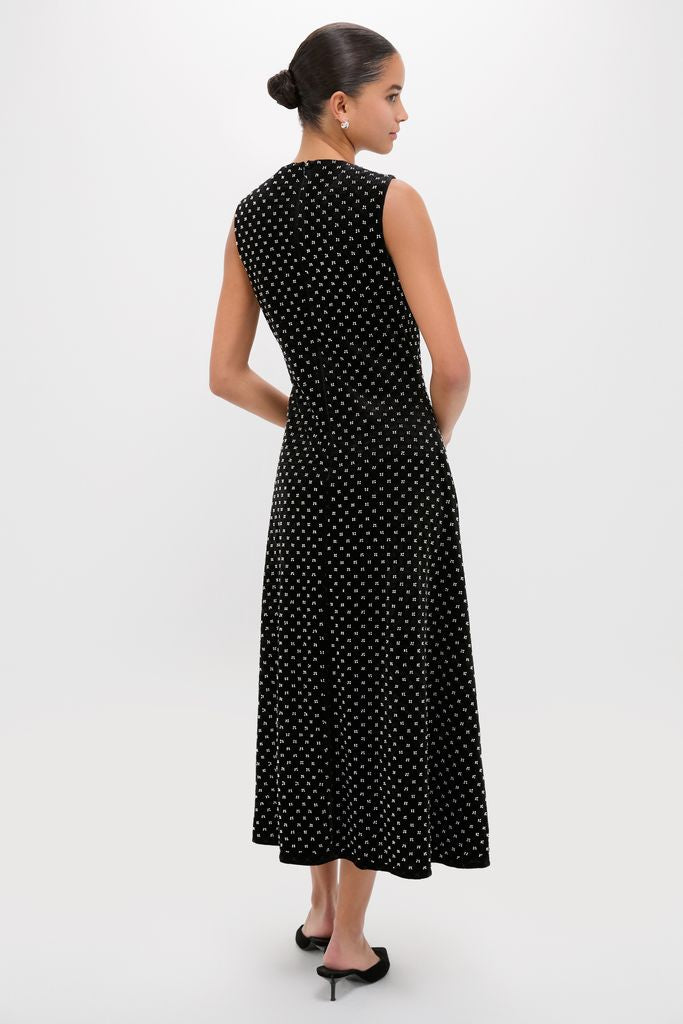 Black Embellished Velvet Antonia Midi Dress, modeled from the back, showcasing classic elegance with a playful dot pattern, embodying effortless, high-end style.