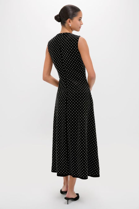 Black Embellished Velvet Antonia Midi Dress, modeled from the back, showcasing classic elegance with a playful dot pattern, embodying effortless, high-end style.