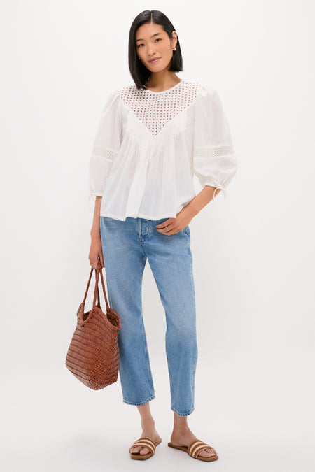 Effortlessly stylish, the Honey Piper Sandals feature classic woven stripes, perfectly complementing a white blouse and jeans for a fun, high-end look.