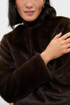 Classic Dark Brown Cassidy Faux Fur Jacket showcases effortless high-end style with plush texture, front closures, and gold hoop earrings for a fun, chic winter look.