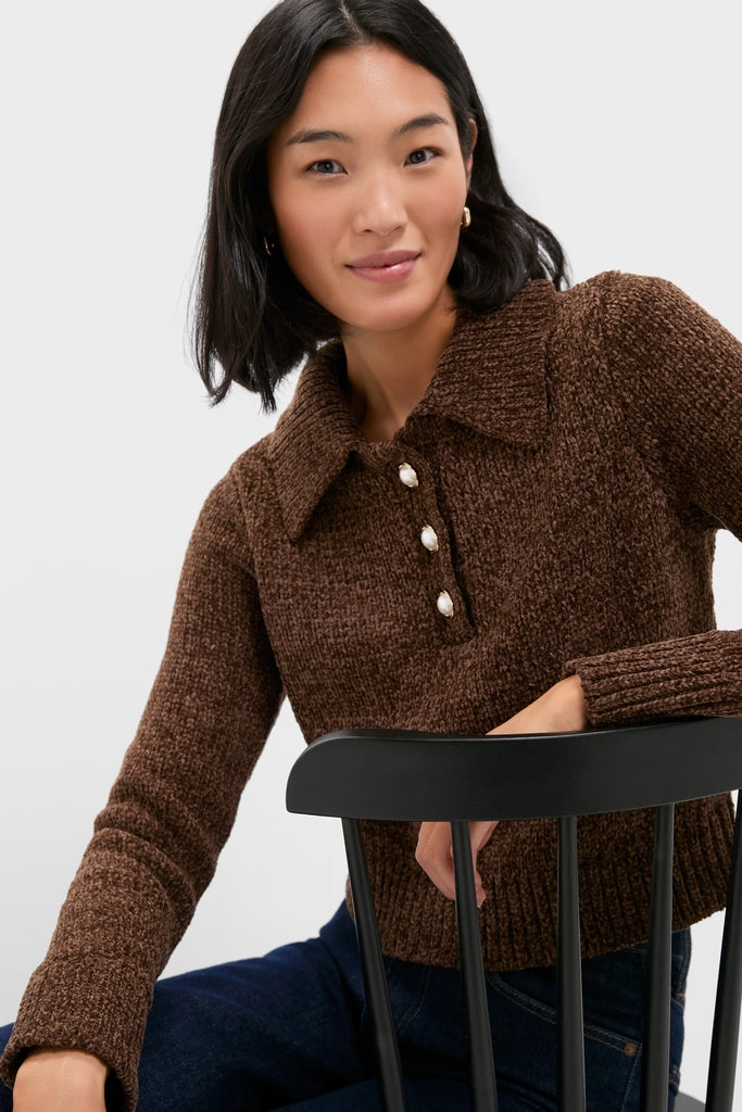 Model wearing the Brown Fraser Sweater, showcasing its classic, textured knit design with a polo collar and pearl-look buttons, embodying an effortless, high-end style.