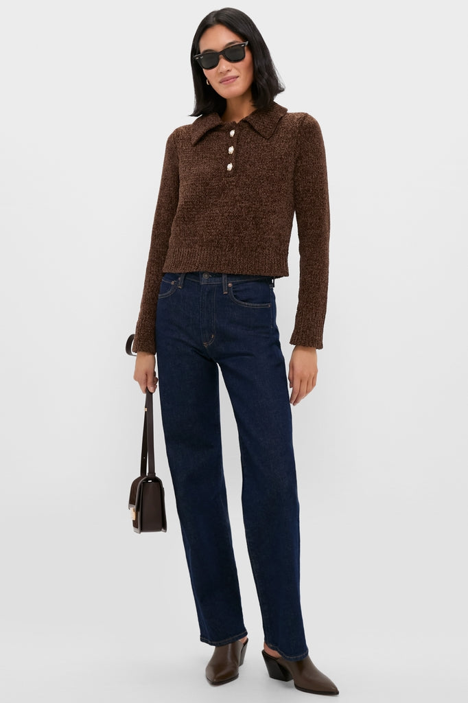 Model wearing the classic Brown Fraser Sweater, effortlessly paired with high-waisted indigo jeans and brown leather mules, showcasing a high-end, fun, and versatile look.