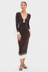 Model wearing classic Espresso Egret Long Sleeve Ribbed Maxi Dress with V-neck and teardrop cutout, paired with black sandals for an effortless, high-end look.