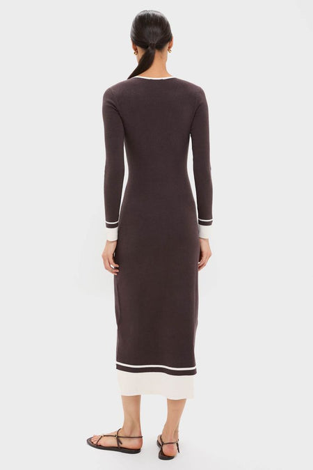Model in classic Espresso Egret Long Sleeve Ribbed Maxi Dress with V-neckline, mid-calf length, and white trim, showcasing an effortless, high-end vacation style.