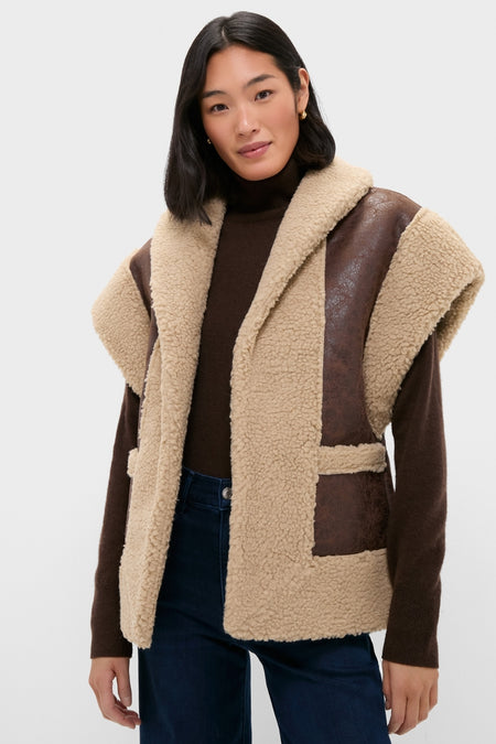 Model wearing the classic Brown Ace Faux Shearling Vest with chunky teddy-fleece texture and leather-look accents, paired effortlessly with a dark turtleneck and jeans.