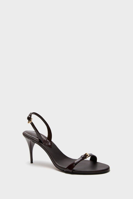 Maplewood Aurora Sling Mid Heels: classic patent-leather dress sandal with stiletto heel, elegant straps, and gold buckle details; exudes effortless style and high-end sophistication.