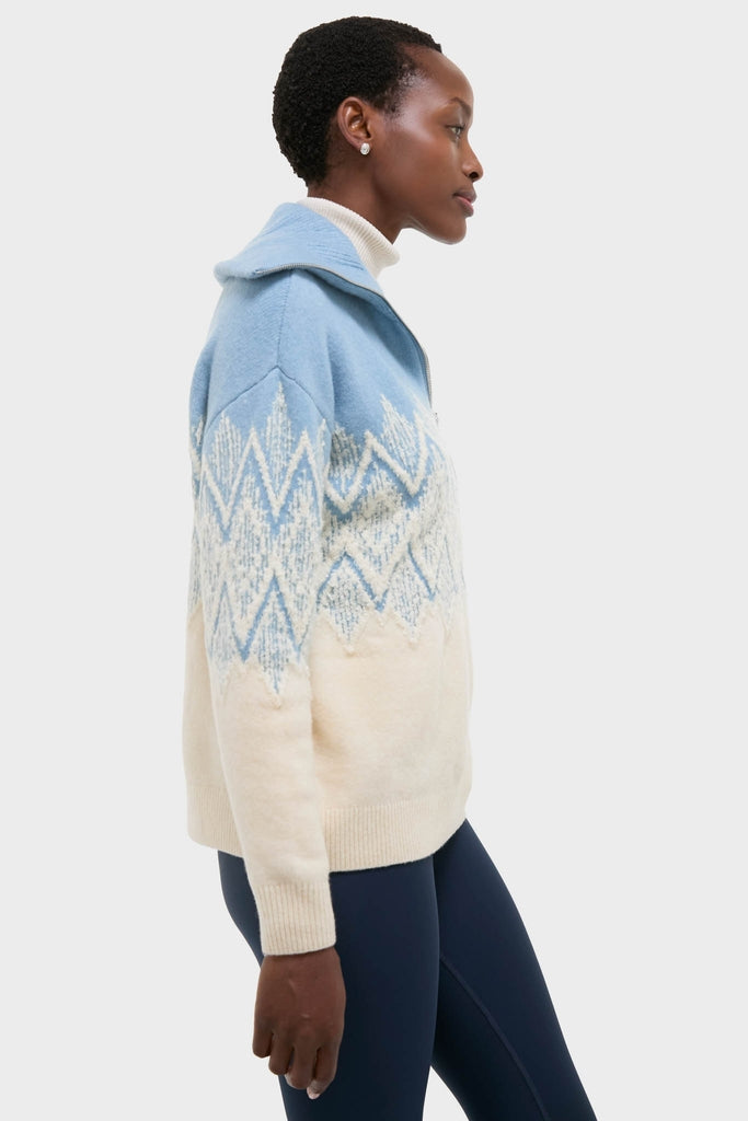 Ashley Blue Hedda Fairisle Half Zip: Classic and effortless knit pullover featuring a textured jacquard pattern, paired with a white turtleneck and navy leggings for a high-end, fun look.