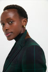 Young Black woman in a classic Green Navy Multi Tartan Brushed Wool Blazer, embodying effortless style with a fun, high-end touch from Tuckernuck.