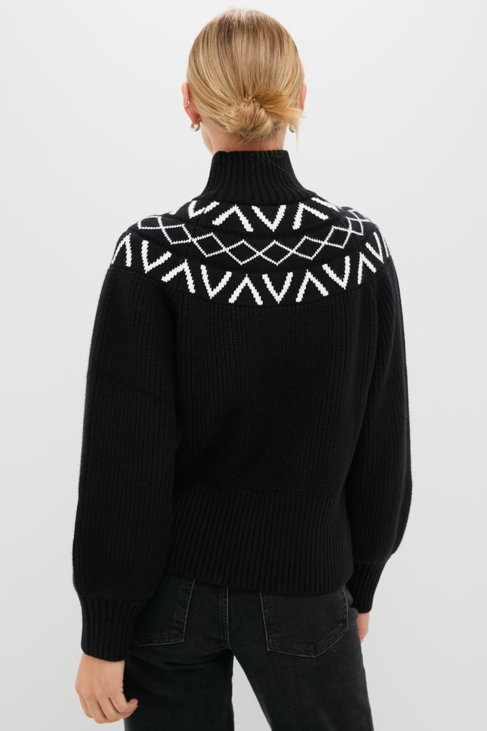 Back view of a woman in a classic Black Marcie Fairisle Yoke Knit, showcasing its effortless design with fun geometric patterns, balloon sleeves, and a relaxed fit.