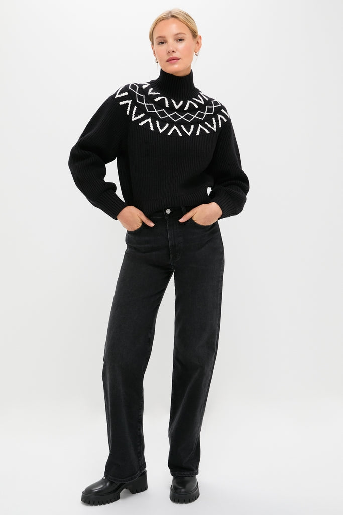 Model wears Black Marcie Fairisle Yoke Knit with geometric pattern, paired with straight-leg jeans and lug-soled boots, exuding classic, effortless, and high-end winter style.