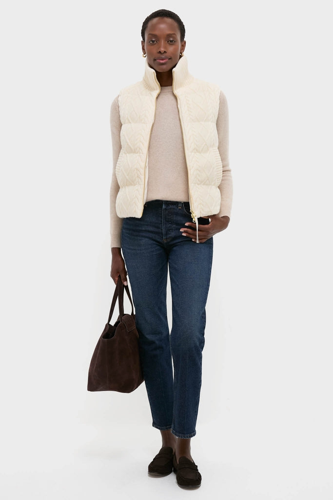 Egret Irina Cable Knit Gilet offers a classic, effortless style with cable-knit design and rib-knit trim, perfect for a high-end, fun, and versatile fall outfit.