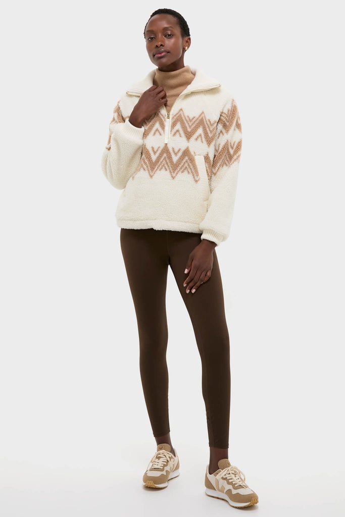 Woman wearing Egret Hendrik Half Zip Sherpa with jacquard diamond pattern. Effortless, classic look featuring a relaxed fit, ideal for high-end, fun winter styling.