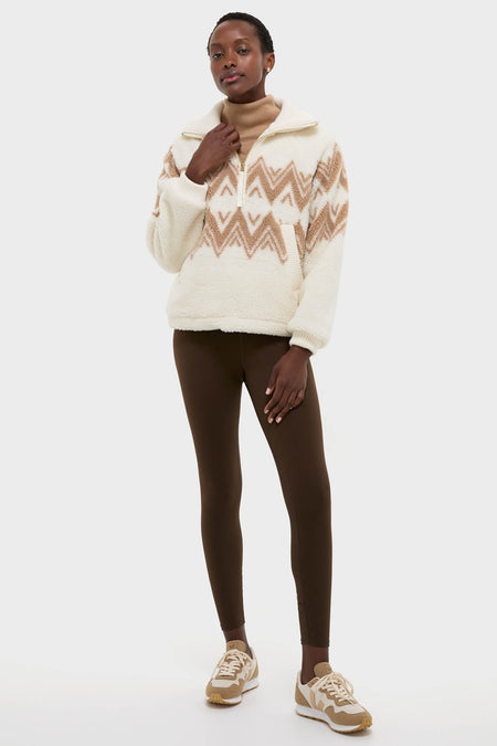 Woman wearing Egret Hendrik Half Zip Sherpa with jacquard diamond pattern. Effortless, classic look featuring a relaxed fit, ideal for high-end, fun winter styling.