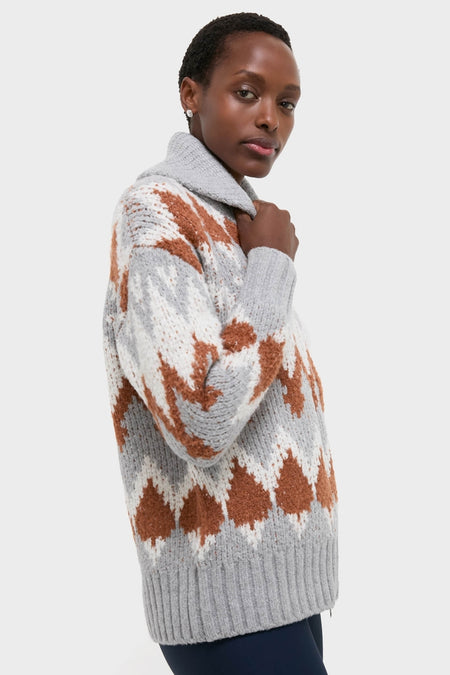 Woman in a Grey Melange Brockley Jacquard Knit Jacket, featuring a classic chunky knit turtleneck with effortless geometric patterns, embodying Tuckernuck's high-end, fun style.