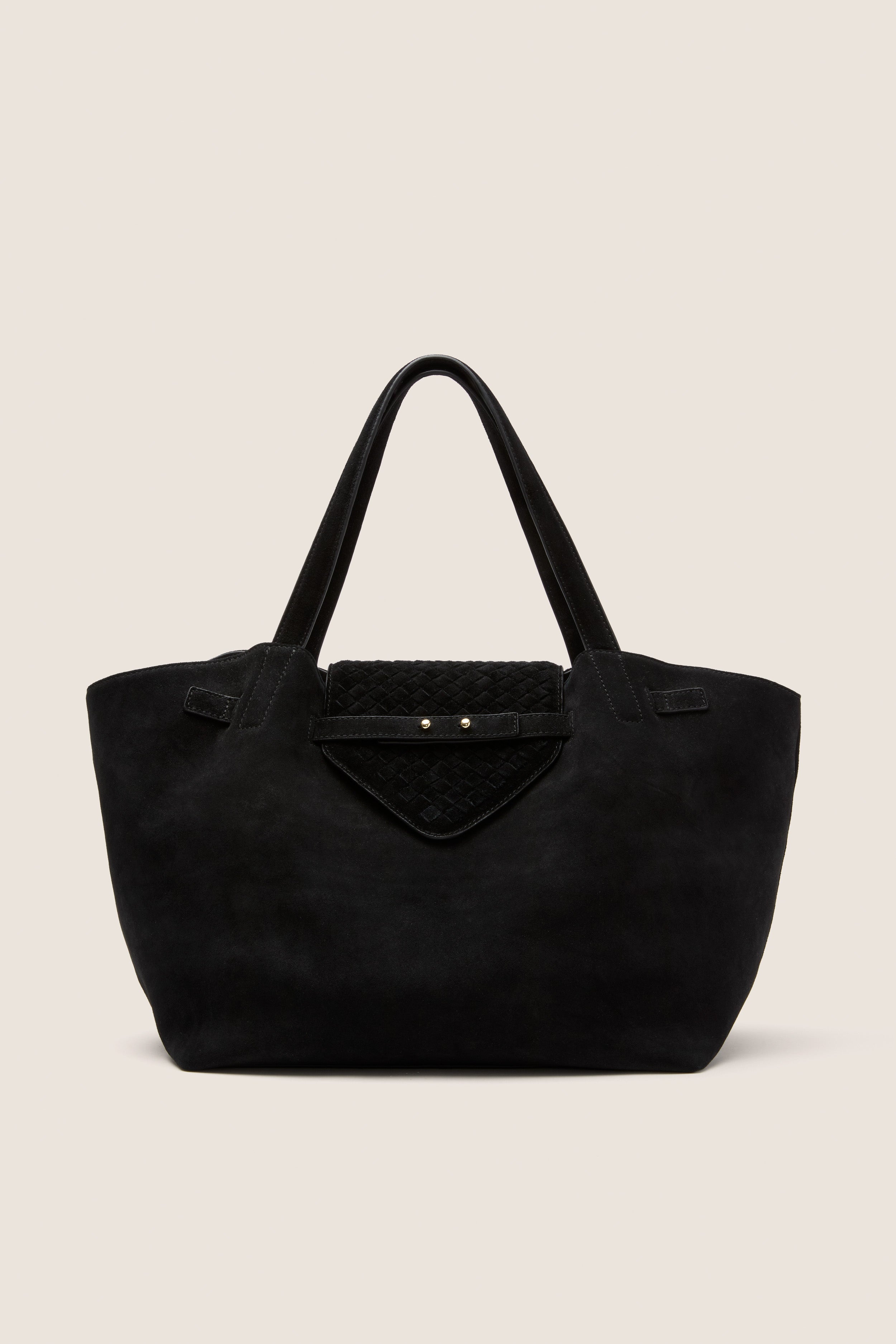 Black Suede Blaine Tote with broad shoulder straps, quilted flap pocket, and gold-tone studs; a classic, high-end work bag blending effortless style with practical design.