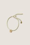 Vineyard Bracelet Cord with Butterfly Charm: A classic, effortless piece featuring a pastel cord with a gold butterfly and heart charm, perfect for fun, high-end wrist styling.