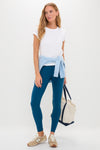 Woman modeling Harbor Blue High Rise Long Compression Spandex MacKenzie Legging, paired with a casual T-shirt and sneakers, holding a chic tote bag. Effortless, classic, and high-end style.