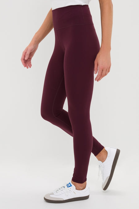 Winetasting High Rise Long Compression Spandex MacKenzie Legging paired with white sneakers, showcasing a classic, effortless fit for a fun, high-end look.