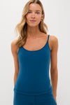 Model wearing the Harbor Blue Compression Spandex Sofia Cami, showcasing its classic round neckline, adjustable straps, and built-in shelf bra for an effortless, high-end, and fun look.