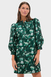 Woman in Emerald Magnolia Floral Jacquard Samantha Dress with puffed sleeves and button front, embodying classic, effortless style; perfect for high-end, fun occasions.