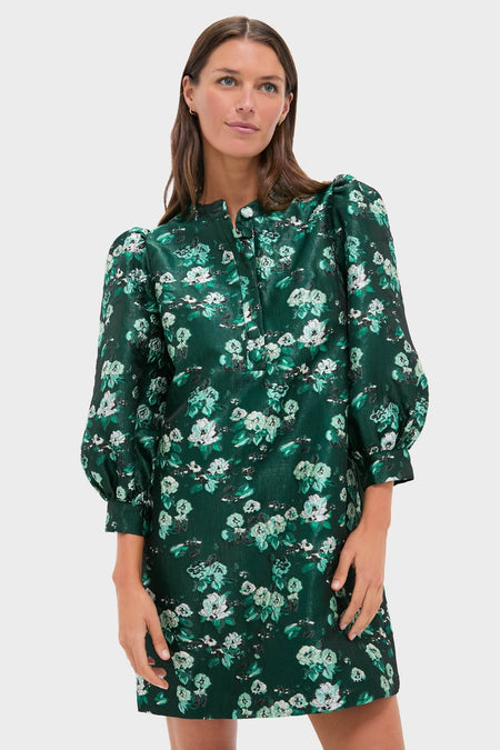 Woman in Emerald Magnolia Floral Jacquard Samantha Dress with puffed sleeves and button front, embodying classic, effortless style; perfect for high-end, fun occasions.