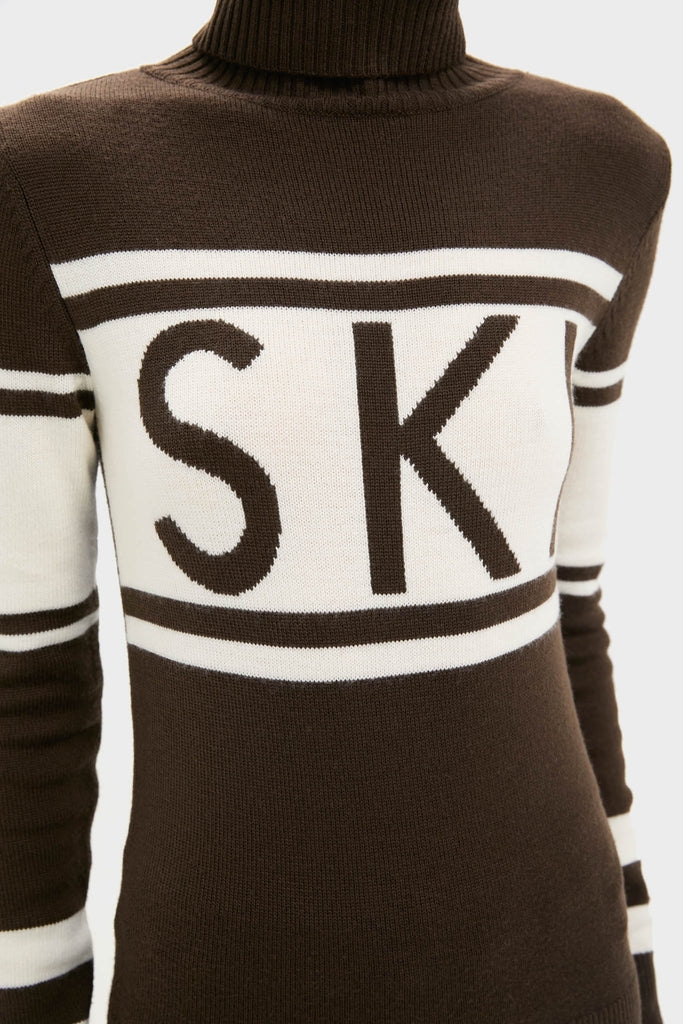 Chocolate Schild Sweater: A classic, high-end turtleneck with SKI intarsia, crafted from soft Merino wool for effortless warmth and fun style on and off the slopes.