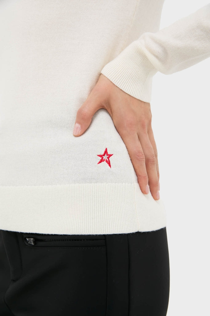 Snow White Neve Wool Sweater: Classic slim-fit, effortless style with ski intarsia, red star emblem, and zippered pocket trousers. Perfect for fun, high-end alpine adventures.