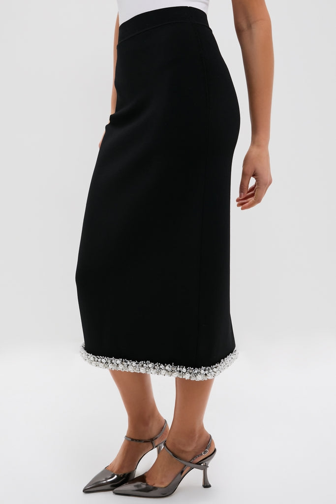 Black Idina Midi Skirt with white bead trim, offering a classic and effortless look. Paired with slingback heels for a fun, high-end style.