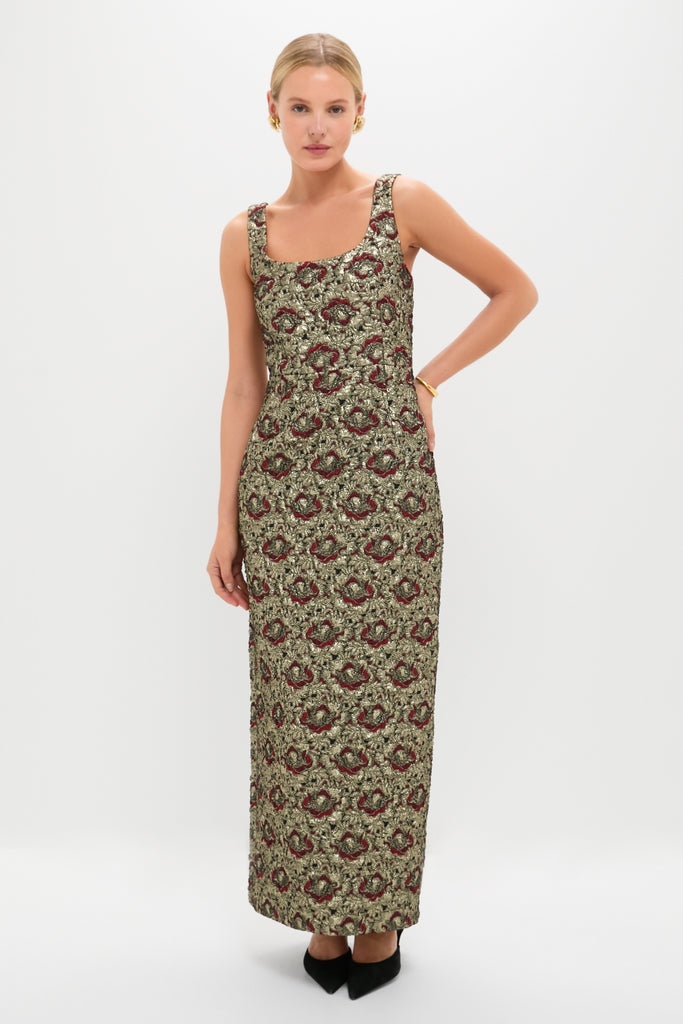 Model in Ruby Multi Ravenna Midi Dress, a classic, high-end brocade gown with a square neckline, styled effortlessly with gold accessories and black heels.