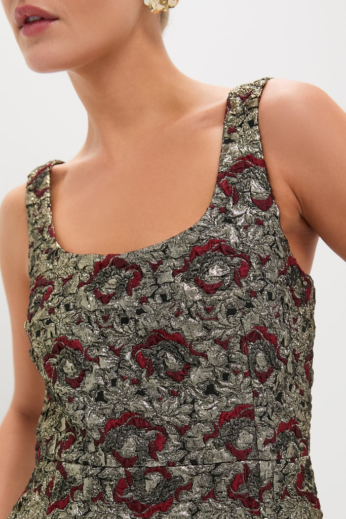 Person wearing the Ruby Multi Ravenna Midi Dress, a classic, sleeveless scoop-neck style in high-end brocade with intricate metallic floral patterns, showcasing effortless elegance and a hint of fun.