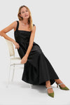 Woman in black maxi dress showcasing classic Fern Satin Mae Heels with crystal-embellished straps; an effortless, high-end choice for fun occasions.