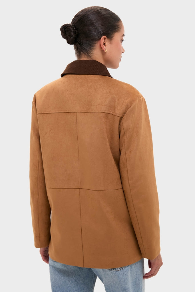 Model showcasing the classic Chestnut Faux Suede Cody Jacket with a dark brown collar, effortlessly styled with light-wash jeans, embodying a fun, high-end look.