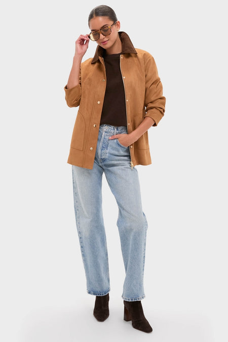 Woman models the classic Chestnut Faux Suede Cody Jacket with patch pockets and contrasting collar, paired with chic jeans and boots, exuding an effortless, high-end style.