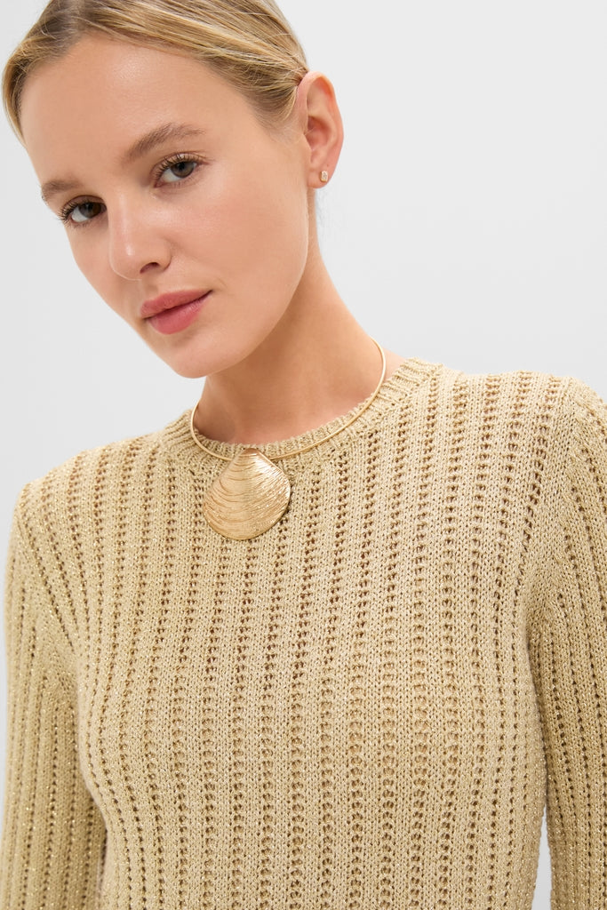 Model showcasing the Gold Knit Amanyara Maxi Dress, featuring a classic, effortless style with a fine gold necklace and textured pendant, epitomizing Tuckernuck's fun, high-end fashion.