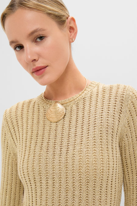 Model showcasing the Gold Knit Amanyara Maxi Dress, featuring a classic, effortless style with a fine gold necklace and textured pendant, epitomizing Tuckernuck's fun, high-end fashion.