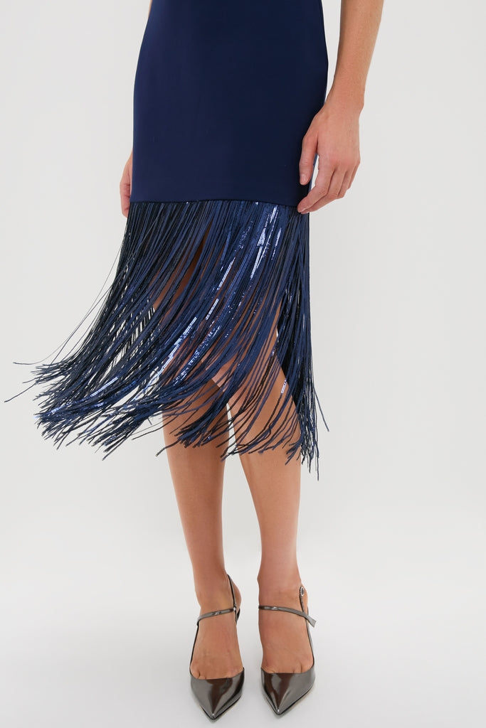 Navy Sequin Fringe Stevie Midi Dress showcases a classic, effortless style with its shiny fringe hem, paired with high-end, pointed-toe, ankle-strap heels for a fun, sophisticated look.