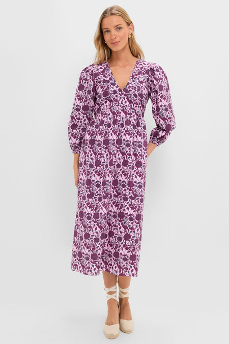 Model showcasing the classic Mauve and Wine Floral Chloe Midi Dress with a V-neckline, empire waist, and puff sleeves, paired with effortless ankle-tie espadrille wedges for a fun, high-end look.