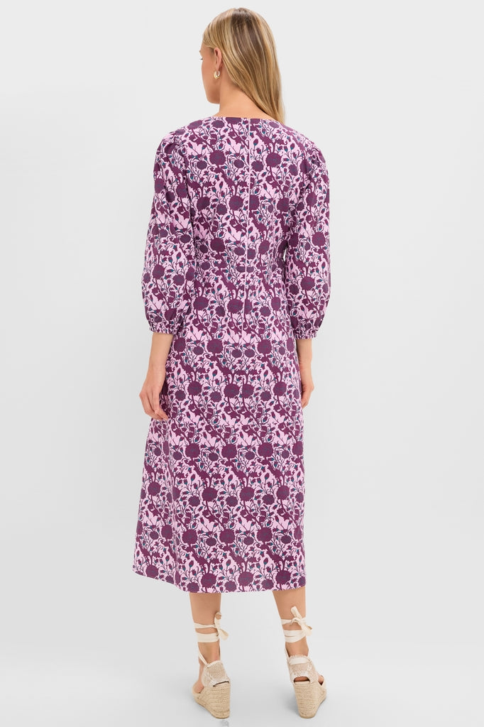 Woman in Mauve and Wine Floral Chloe Midi Dress, showcasing a classic, effortless style with three-quarter sleeves and a tailored waist, paired with fun, high-end espadrille wedge sandals.