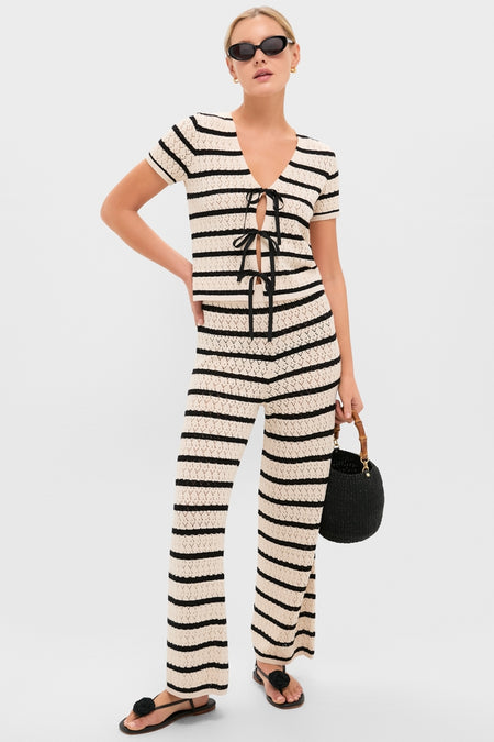Model wears Black & Tan Stripe Portimao Top, a classic, effortless crochet set with front ties, paired with matching pants, embodying fun, high-end Tuckernuck style.