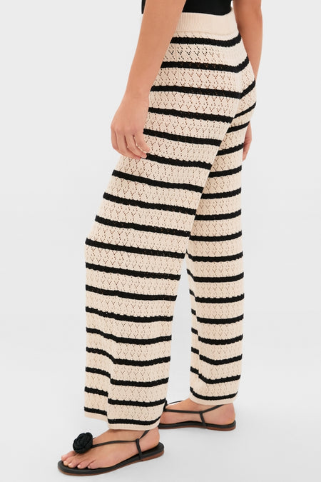 Black & Tan Stripe Portimao Pants, featuring classic wide-leg design, horizontal stripes, and ribbed waistband, paired with black thong sandals for an effortlessly chic, high-end look.