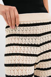 Classic and effortless Black & Tan Stripe Portimao Pants showcase a lace-knit design with a ribbed waistband, delivering high-end fun and coastal chic style.
