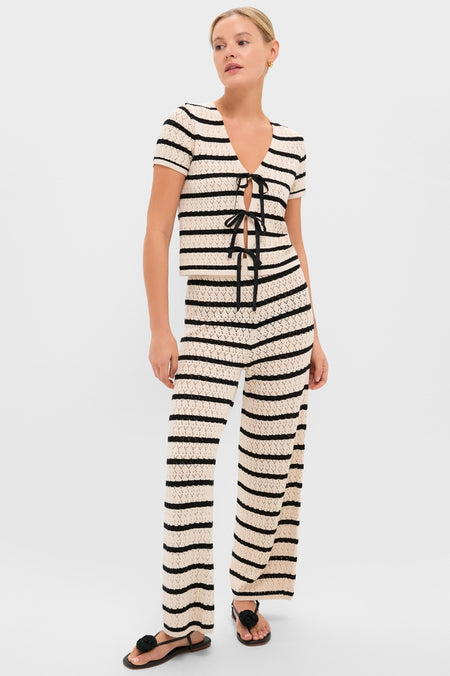 Model in Black & Tan Stripe Portimao Pants, showcasing classic, effortless style with pointelle knit and flared silhouette, paired with matching top for a fun, high-end look.