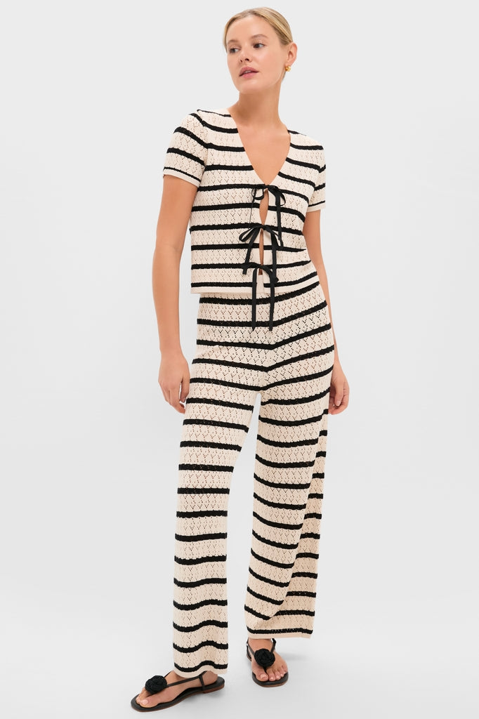 Model in Black & Tan Stripe Portimao Pants, showcasing classic, effortless style with pointelle knit and flared silhouette, paired with matching top for a fun, high-end look.