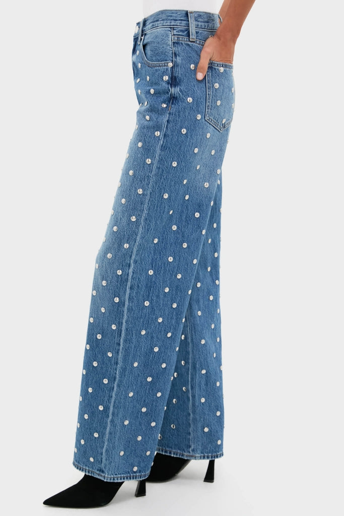 Charmed Hendrix High Rise Baggy jeans with white studs, showcasing a classic, effortless style paired with black stiletto boots for a fun, high-end look.