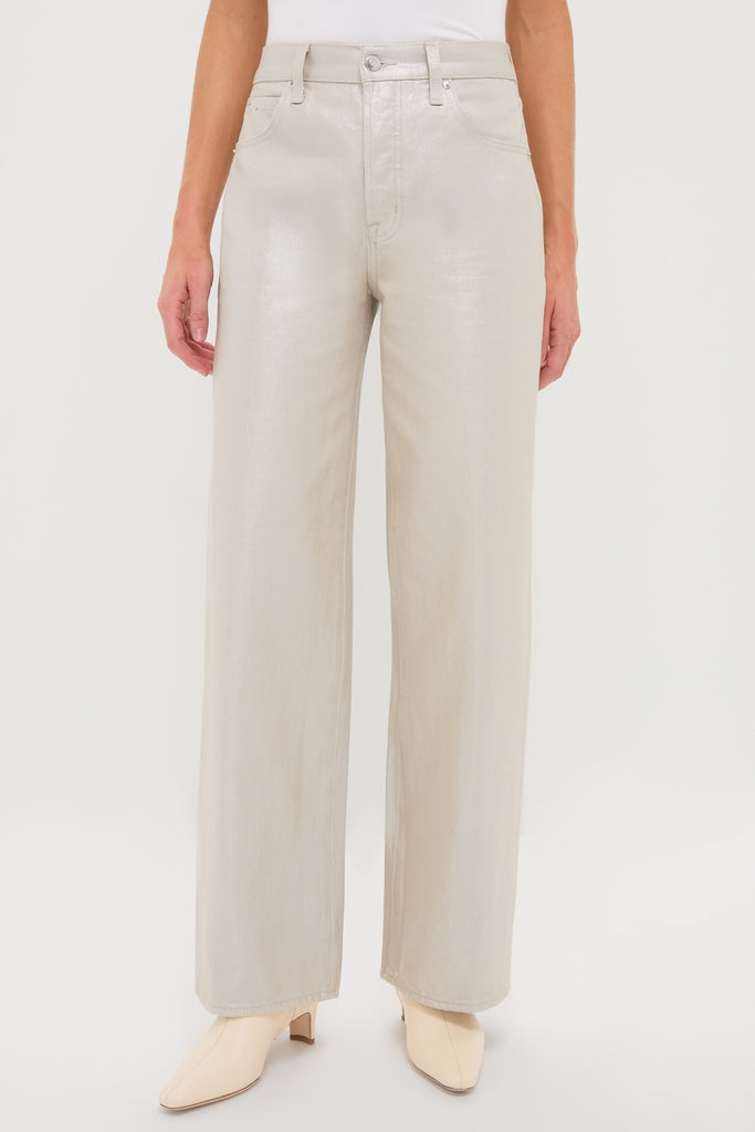 Champagne Luster Tate High Rise Bowed Wide Leg jeans exude effortless elegance with their classic high-waist and wide-leg style, featuring a fun, high-end pearly sheen.
