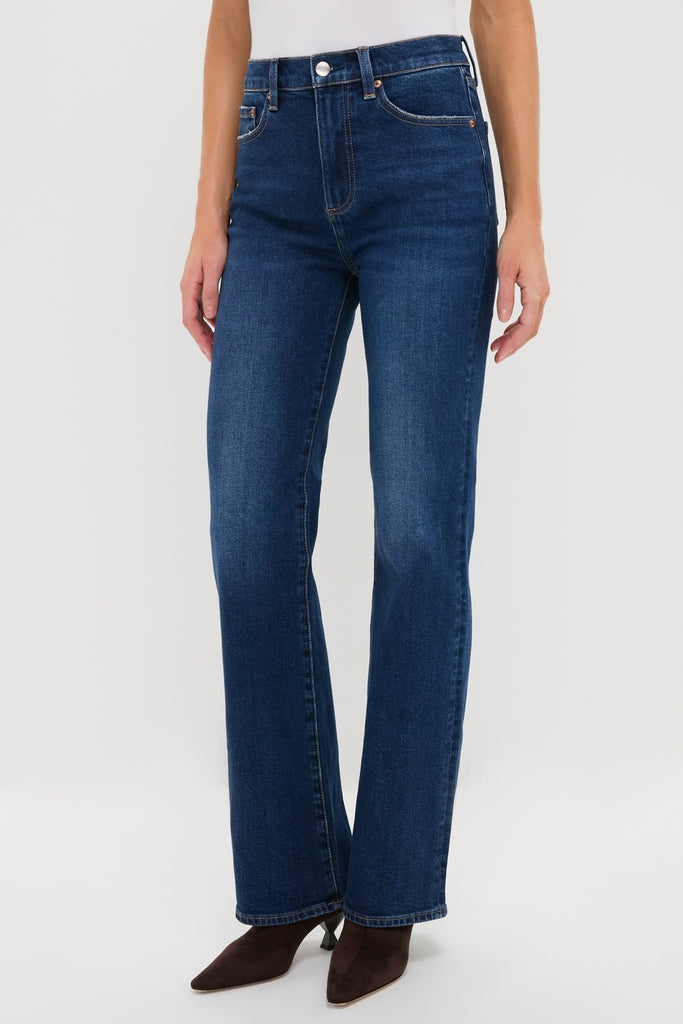 Penthouse Evie High Rise Slim Boot jeans in dark indigo, featuring a classic five-pocket style and subtle bootcut, styled effortlessly with ankle boots and a white top.