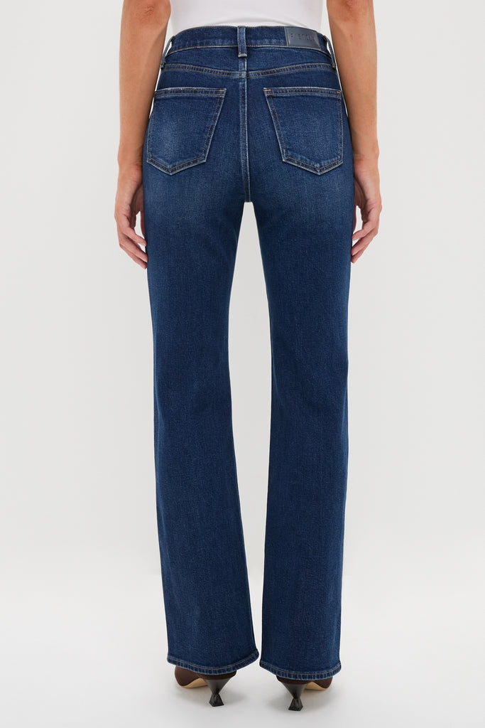 Penthouse Evie High Rise Slim Boot jeans in dark wash, showcasing a classic, effortless fit with subtle bootcut, worn with pointed-toe heels for a high-end, fun style.