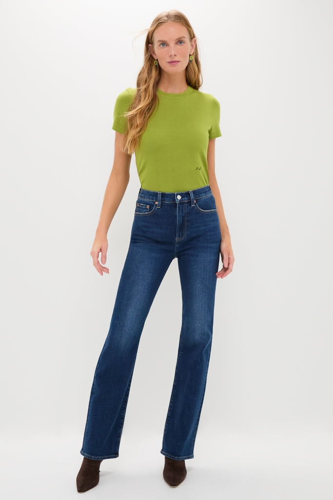 Penthouse Evie High Rise Slim Boot jeans on a woman in chartreuse T-shirt, embodying classic elegance and effortless style with a high-end, flattering silhouette and fun, versatile appeal.